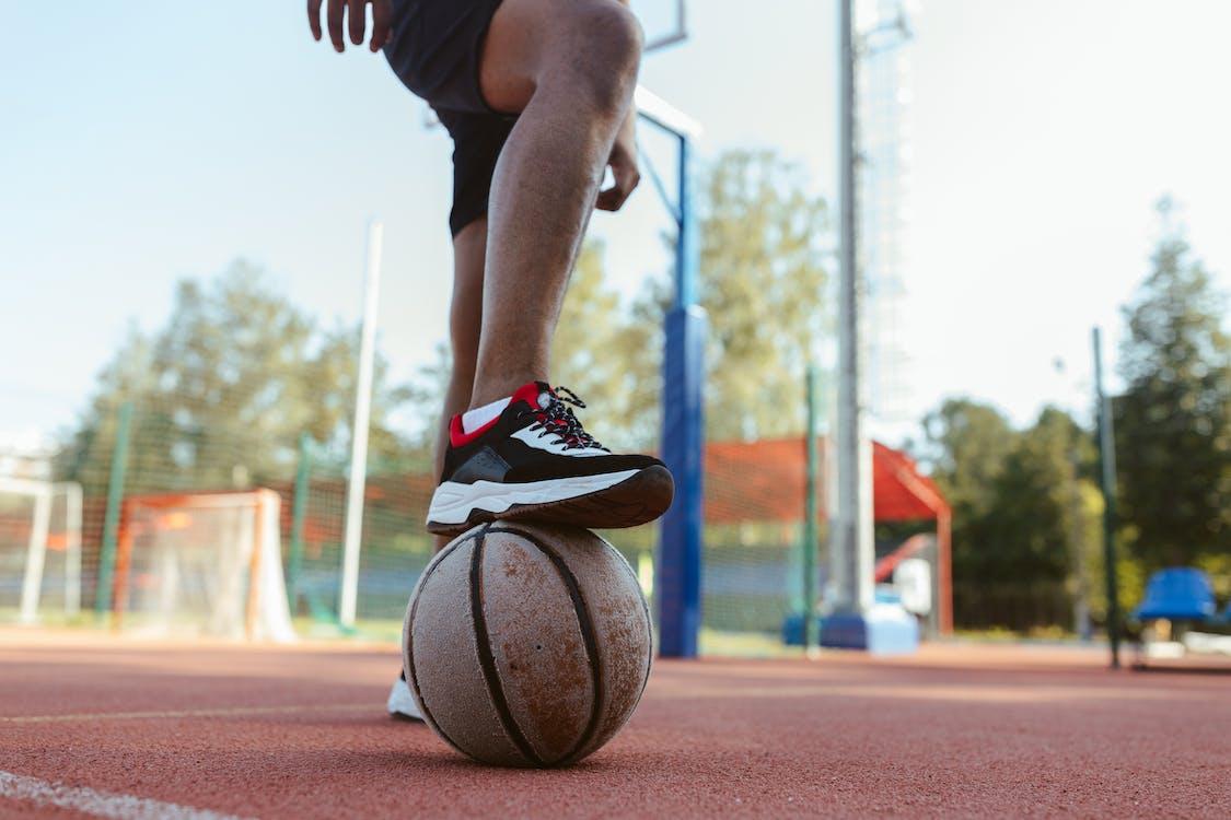 Free Basketball Player Stepping on a ball Stock Photo